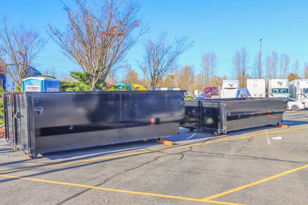 Professional dumpster rental service with roll-off container on residential driveway in Glen Carbon
